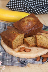 Homemade banana bread sliced on a table . rustic style
