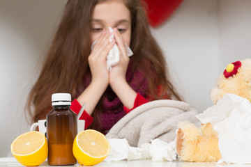 Obraz na płótnie Canvas Little girl with flu, cold or fever at home