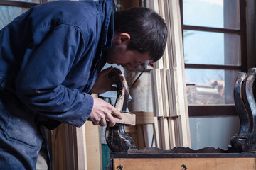 Carpenter restoring Wooden Furniture