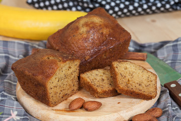Homemade banana bread sliced on a table . rustic style