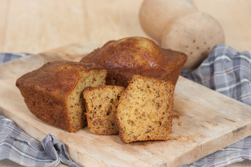 Homemade banana bread sliced on a table . rustic style