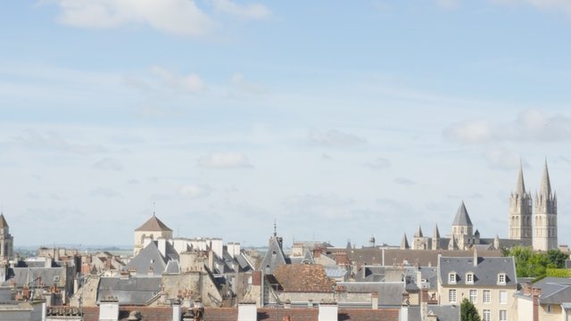 Panning over rooftops in Normandy city of Caen in northern France by the day 4K 3840X2160 UltraHD footage - Calvados region of French city Caen cityscape and roofs slow pan 4K 2160p UHD video 