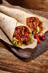 Delicious Mexican wraps with spicy chili con carne