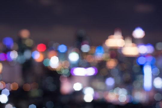 Abstract blurred bokeh lights city skyline during twilight