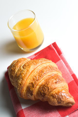 Breakfast coffee, orange juice and croissant