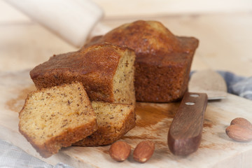 Homemade banana bread sliced on a table . rustic style