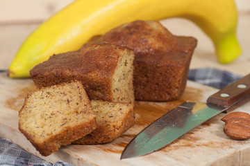 Homemade banana bread sliced on a table . rustic style