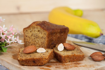 Homemade banana bread sliced on a table . rustic style