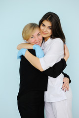 Obraz premium family doctor hugging friendly patient