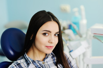 beautiful young girl in the dentist's chair