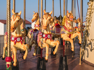 Herne Bay pier, carousel horses in the evening sunshine © Christine Bird
