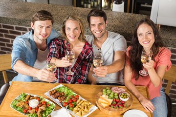 Friends toasting with white wine