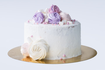 cake with white cream and marshmallows, isolated on a light back