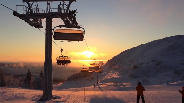 cableway in the sunrise light in ski resort