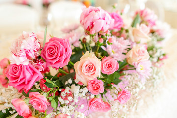 wedding bouquet with rose bush, Ranunculus asiaticus as a backgr