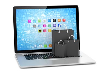 laptop and  shopping pags on white background