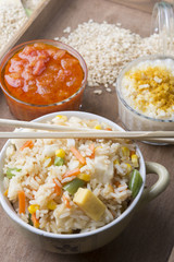 Rice with vegetables on white background