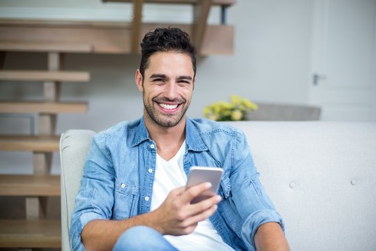 Smiling Smart Man Using Smartphone