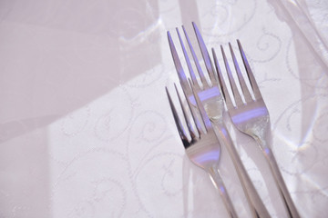 Forks placed on a table in restaurant