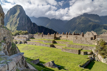 Fototapeta na wymiar Terraces and old building ruins in Machu Picchu, Peru