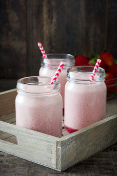 Delicious strawberry smoothie on tray
