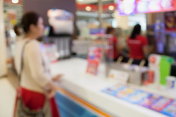 blur woman buying ice cream at store