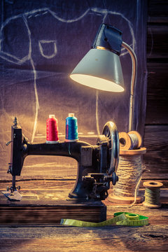 Tailor workshop with sewing machine and cloth