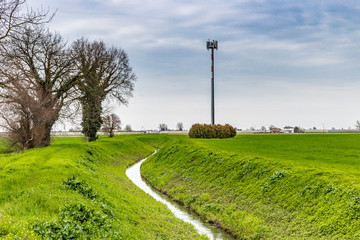 irrigation channel next to cell phone trellis