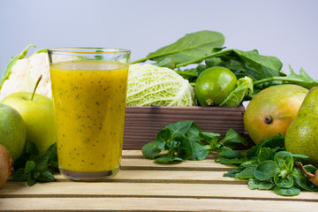 Green fresh smoothie with fruits and vegetables