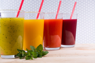 Colofrul fresh pressed fruit juices in tall glasses