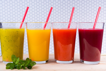 Colofrul fresh pressed fruit juices in tall glasses