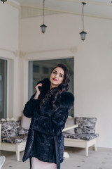 Elegant model in black coat