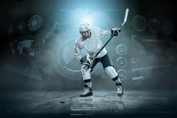Obraz na płótnie Canvas Ice hockey player on the ice around modern light