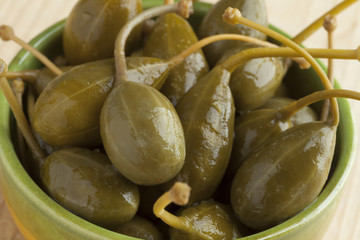 Bowl with pickled caperberries