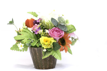 Vase of flowers on white background.