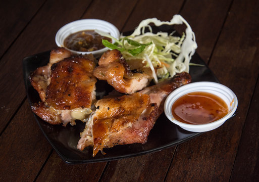 roasted chicken on wooden table, 
