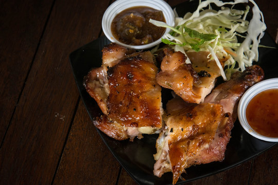 roasted chicken on wooden table, 