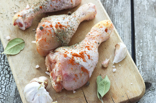 Raw Chicken Legs With Paprika, Seasoning And Garlic