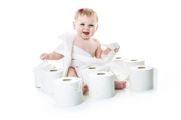 Toddler ripping up toilet paper in bathroom studio