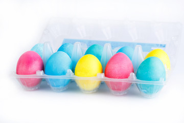 Colorful easter eggs in package isolated.