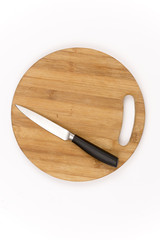 Top view of kitchen knife on the wooden board