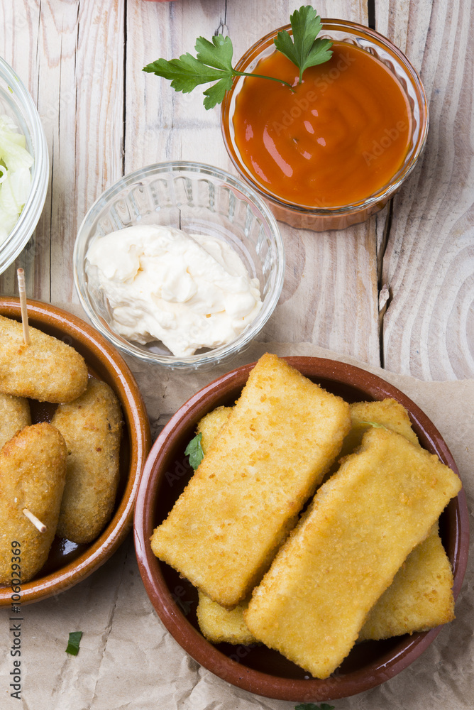 Wall mural croquettes balls and different kind of sauces on a plate on a cl