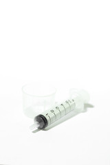 Medium feeding syringe on white background
