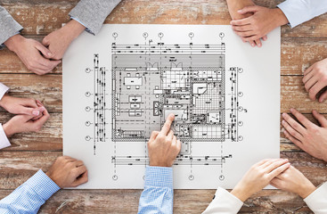Naklejka premium close up of business group with blueprint