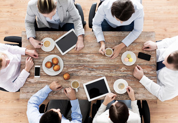 close up of business team drinking coffee on lunch