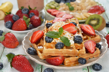 Waffles with strawberries, strawberries and whipped cream