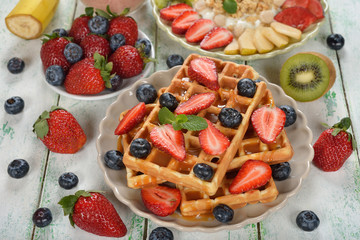 Waffles with berries and caramel sauce