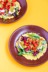 Chicken and Salad Tortilla with Avocado on Orange Background, Top View, Vertical View