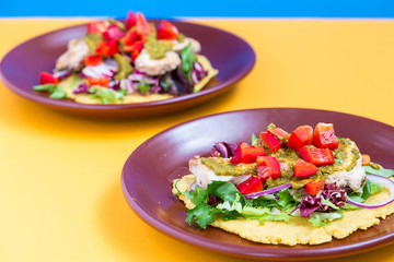 Chicken and Salad Tortilla with Avocado on Orange and Blue Background, Top View, Horizontal