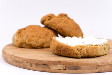 Breakfast bread with cream on the kitchen board